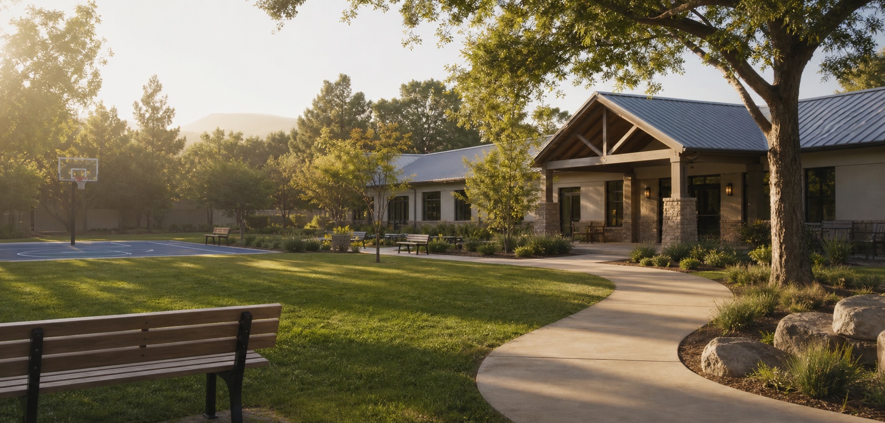 Peaceful therapeutic residential campus with trees and a structured outdoor courtyard